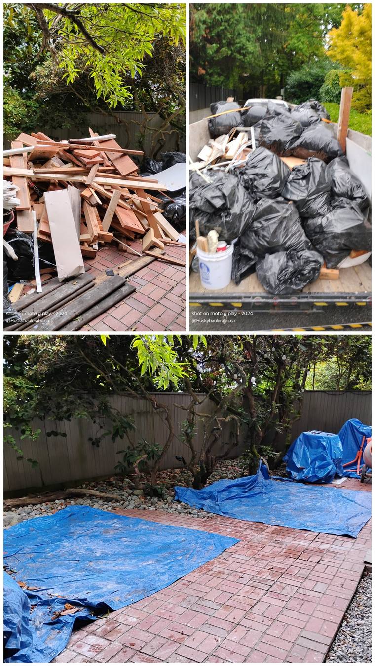 Lumber and drywall debris, a loaded trailer, and the cleared patio