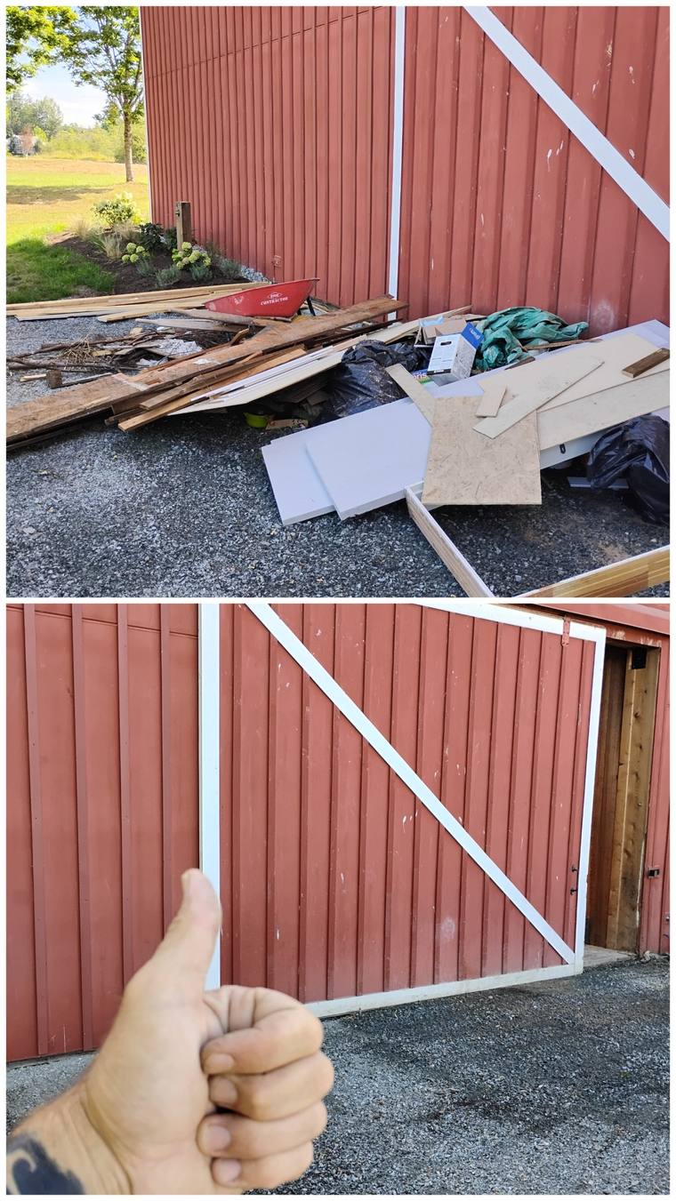 Construction debris beside a red barn, then cleared
