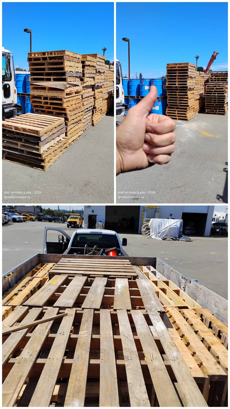 Stacks of wood pallets and a truck loaded with pallets